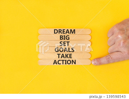Dream big take action words symbol. Concept words Dream big Set goals Take action on beautiful wooden sticks. Beautiful yellow background. Business Dream big Set goals Take action concept. Copy space. Dream big take action words symbol. Concept words Dream big Set goals Take action on beautiful wooden sticks. Beautiful yellow background. Business Dream big Set goals Take action concept. Copy space. 139598543