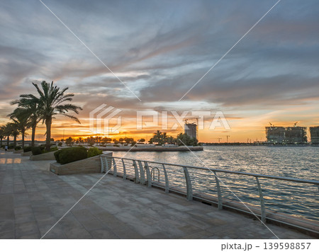 Sunset Over Al Raha Beach, Abu Dhabi with Palm Trees and Waterfront Promenade Sunset Over Al Raha Beach, Abu Dhabi with Palm Trees and Waterfront Promenade 139598857