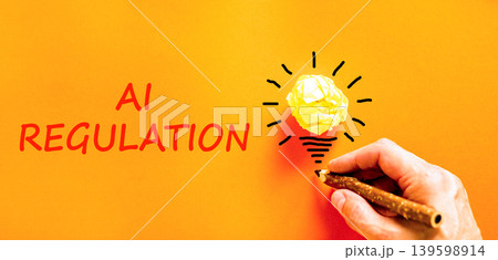 AI regulation symbol. Concept words AI artificial intelligence regulation on beautiful orange paper. Beautiful orange background. Business AI artificial intelligence regulation concept. Copy space. AI regulation symbol. Concept words AI artificial intelligence regulation on beautiful orange paper. Beautiful orange background. Business AI artificial intelligence regulation concept. Copy space. 139598914