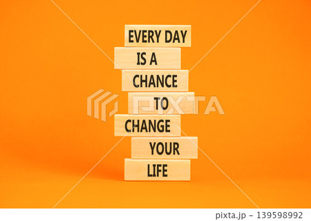 Change your life symbol. Concept words Every day is a chance to change your life on beautiful wooden blocks. Beautiful orange paper background. Business change your life concept. Copy space. 139598992