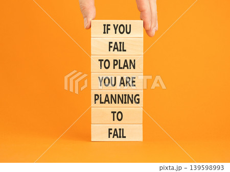 Planning to fail symbol. Concept words If you fail to plan you are planning to fail on beautiful wooden blocks. Beautiful orange paper background. Business planning to fail concept. Copy space. 139598993