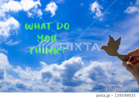What do you think symbol. Concept words What do you think on beautiful blue sky. Beautiful blue sky background. Businessman hand. Business What do you think motivational support concept. Copy space. 139599035
