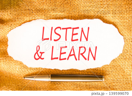 Listen and learn words symbol. Concept words Listen and learn on beautiful white paper. Beautiful canvas background. Business listen and learn support concept. Copy space. 139599070