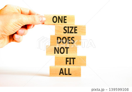 One size does not fit all symbol. Concept words One size does not fit all on wooden stick. Beautiful white background. Businessman hand. One size does not fit all business concept. Copy space. One size does not fit all symbol. Concept words One size does not fit all on wooden stick. Beautiful white background. Businessman hand. One size does not fit all business concept. Copy space. 139599108