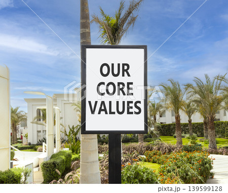 Our core values words symbol. Concept words Our core values on beautiful white sign. Beautiful hotel garden blue sky background. Business our core values motivational support concept. Copy space. 139599128