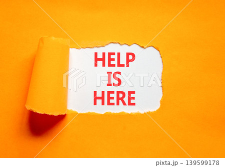Help is here and support words symbol. Concept words Help is here on beautiful white paper. Beautiful orange background. Business help is here and support concept. Copy space. Help is here and support words symbol. Concept words Help is here on beautiful white paper. Beautiful orange background. Business help is here and support concept. Copy space. 139599178