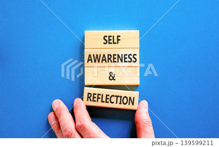 Self awareness and reflection symbol. Concept words Self awareness and reflection on beautiful wooden blocks. Beautiful blue background. Psychological self awareness reflection concept. Copy space. Self awareness and reflection symbol. Concept words Self awareness and reflection on beautiful wooden blocks. Beautiful blue background. Psychological self awareness reflection concept. Copy space. 139599211