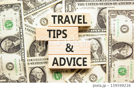 Travel tips and advice words symbol. Concept words Travel tips and advice on beautiful wooden blocks. Beautiful dollar bills background. Business lifestyle travel tips and advice concept. Copy space. Travel tips and advice words symbol. Concept words Travel tips and advice on beautiful wooden blocks. Beautiful dollar bills background. Business lifestyle travel tips and advice concept. Copy space. 139599216