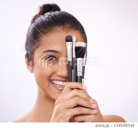 Makeup, brushes and woman face with eyes cosmetics in studio for beauty and foundation on a white background. Young model, artist or person in portrait for skincare, eyeshadow or product for coverage Makeup, brushes and woman face with eyes cosmetics in studio for beauty and foundation on a white background. Young model, artist or person in portrait for skincare, eyeshadow or product for coverage 139599348
