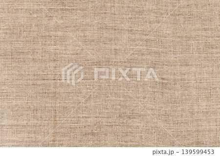 Rough woven burlap fabric in neutral beige tones Rough woven burlap fabric in neutral beige tones 139599453
