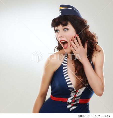Surprise, woman and a flight attendant with shock in studio isolated on a white background mockup space. Wow, travel and excited sailor in hat for journey, travel and announcement for retro fashion Surprise, woman and a flight attendant with shock in studio isolated on a white background mockup space. Wow, travel and excited sailor in hat for journey, travel and announcement for retro fashion 139599485