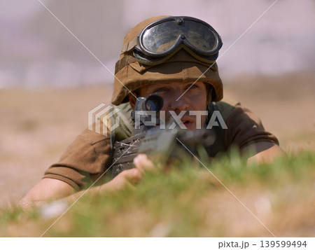 Military, warrior and aim with man and gun in nature for war, conflict and patriotism. Army, surveillance and security with person and sniper rifle training for soldier, battlefield and veteran Military, warrior and aim with man and gun in nature for war, conflict and patriotism. Army, surveillance and security with person and sniper rifle training for soldier, battlefield and veteran 139599494