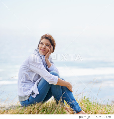 Woman, thinking and relax at beach in nature with happiness, gratitude and peace on holiday or vacation. Mindfulness, mock up and person on hill at the ocean or sea with ideas for future or travel 139599526
