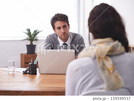 Coworkers, laptop and office with interview, conversation and technology in workplace. Man, woman and businesspeople with manager, team or recruitment with discussion, mentor and professional 139599537
