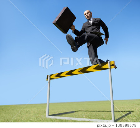 Businessman, hurdle and jumping for career challenge or competition or employee obstacles, growth or achievement. Male person, briefcase and leap at work for professional goals, overcome or milestone Businessman, hurdle and jumping for career challenge or competition or employee obstacles, growth or achievement. Male person, briefcase and leap at work for professional goals, overcome or milestone 139599579