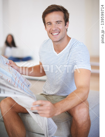 Man, portrait and reading newspaper for information at home for global events, knowledge or politics. Male person, print media and article for morning or worldwide good news, international or report 139599714