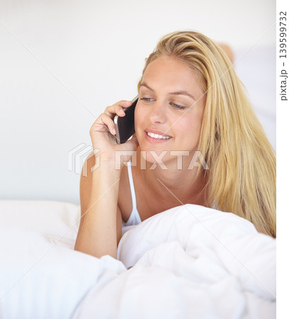 Home, bedroom and phone call with woman, communication and connection with network, smile and relax. Apartment, person and girl on a bed, smartphone and mobile user with conversation and speaking Home, bedroom and phone call with woman, communication and connection with network, smile and relax. Apartment, person and girl on a bed, smartphone and mobile user with conversation and speaking 139599732