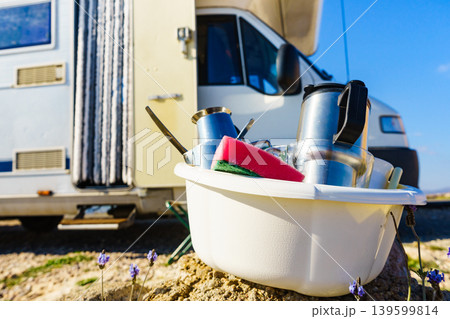 Washing dishes in bowl, capming outdoor Washing dishes in bowl, capming outdoor 139599814