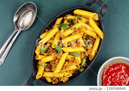 Penne pasta with fried minced meat and green onion Penne pasta with fried minced meat and green onion 139599940