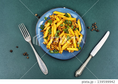 Penne pasta with fried minced meat and green onion 139599942