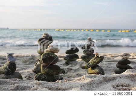 Stones balance on beach, sea shot. Meditation and relax background Stones balance on beach, sea shot. Meditation and relax background 139600091