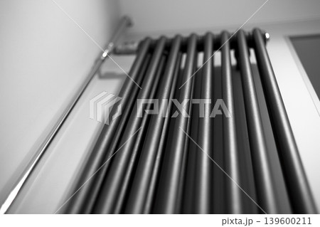 Modern vertical Wall Mounted Radiator for an apartment. Efficient Heating Solutions Modern vertical Wall Mounted Radiator for an apartment. Efficient Heating Solutions 139600211