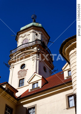 Astronomical Tower of the Klementinum in Prague with Atlant statue holding heavens, Czech Republic, clear blue sky, sunny day 139600269