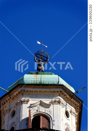 Astronomical Tower of the Klementinum in Prague with Atlant statue holding heavens, Czech Republic, clear blue sky, sunny day Astronomical Tower of the Klementinum in Prague with Atlant statue holding heavens, Czech Republic, clear blue sky, sunny day 139600280