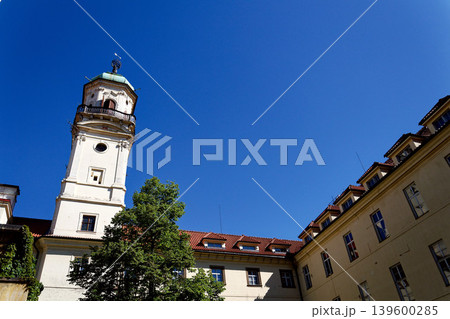 Astronomical Tower of the Klementinum in Prague with Atlant statue holding heavens, Czech Republic, clear blue sky, sunny day 139600285