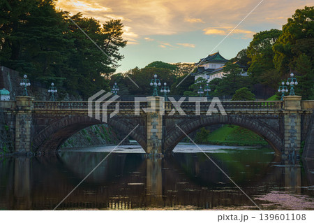 Tokyo, Japan - Oct 1 2024, A panoramic view of Nijubashi Bridge leading to main entrance of the Tokyo Imperial Palace grounds, with evening sky and colorful clouds in the background, Tokyo, Japan Tokyo, Japan - Oct 1 2024, A panoramic view of Nijubashi Bridge leading to main entrance of the Tokyo Imperial Palace grounds, with evening sky and colorful clouds in the background, Tokyo, Japan 139601108
