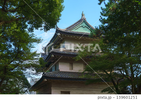 Tokyo, Japan - Oct 01 2024, panoramic view of the Fujimi-yagura watchtower surrounded by tree foliage, against the blue sky, part of the Tokyo Imperial Palace, Tokyo, Japan Tokyo, Japan - Oct 01 2024, panoramic view of the Fujimi-yagura watchtower surrounded by tree foliage, against the blue sky, part of the Tokyo Imperial Palace, Tokyo, Japan 139601251