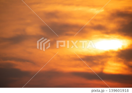 Warm orange sunset clouds spreading across the evening sky with glowing sunlight and soft dramatic textures, ideal for backgrounds and atmospheric nature concepts. Warm orange sunset clouds spreading across the evening sky with glowing sunlight and soft dramatic textures, ideal for backgrounds and atmospheric nature concepts. 139601918