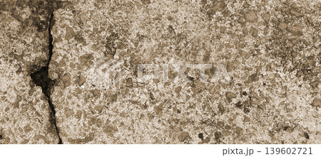 Close-up Texture of a Cracked Concrete Surface Background Close-up Texture of a Cracked Concrete Surface Background 139602721