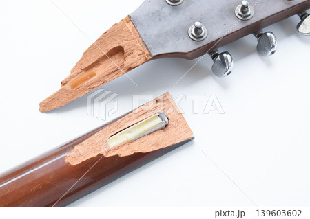 part of broken wood acoustic guitar isolated on white background part of broken wood acoustic guitar isolated on white background 139603602