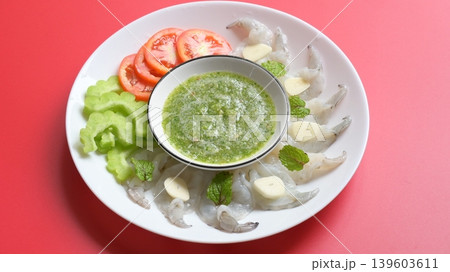 shrimp in fish sauce with Thai spicy seafood dipping sauce on white plate shrimp in fish sauce with Thai spicy seafood dipping sauce on white plate 139603611