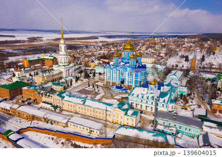 Aerial view of the Nativity-Bogoroditsky monastery surrounded by residential buildings in Zadonsk Aerial view of the Nativity-Bogoroditsky monastery surrounded by residential buildings in Zadonsk 139604015