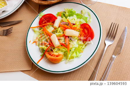 Light vegetable salad with tomatoes in a plate 139604593