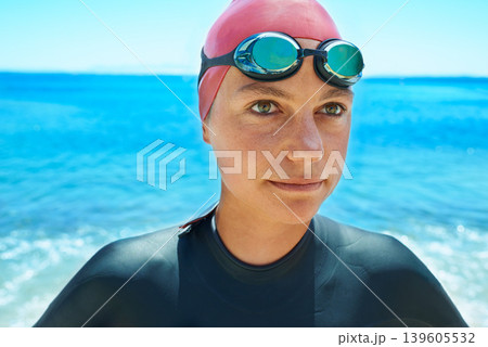 Swimmer sport, face and woman at sea outdoor in summer for exercise, training or workout. Ocean, athlete and person in goggles in nature for fitness, health or triathlon competition at beach water 139605532