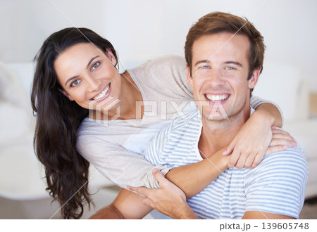 Portrait, couple hug and love with trust, marriage and happiness at home, healthy relationship and affection. People bonding, loyalty and connection with smile, partner and romance together at house 139605748