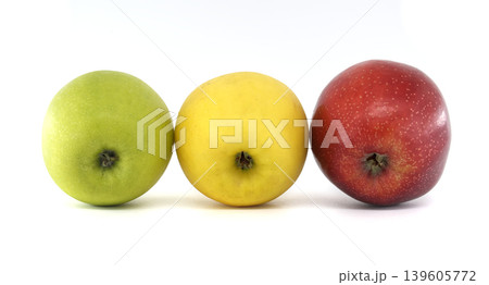 Three different colored apples lined up in a row on a white background Three different colored apples lined up in a row on a white background 139605772