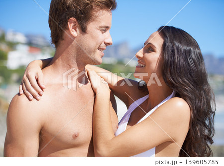 Happy couple, hug on beach and summer for vacation, holiday and valentines day or anniversary in bikini. Young woman and man with love, smile and excited by sea, ocean or outdoor in tropical city Happy couple, hug on beach and summer for vacation, holiday and valentines day or anniversary in bikini. Young woman and man with love, smile and excited by sea, ocean or outdoor in tropical city 139605785