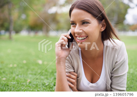 Woman, phone call and communication on grass for connection, conversation or advice. Female person, digital device and smile in nature or speaking chat for exciting news, information or discussion Woman, phone call and communication on grass for connection, conversation or advice. Female person, digital device and smile in nature or speaking chat for exciting news, information or discussion 139605796