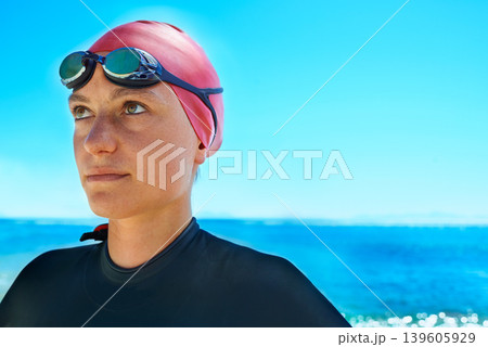 Swimmer sport, face and woman at ocean outdoor in summer for exercise, thinking of training or vision. Sea, athlete and person in goggles for fitness, health or idea at beach water on mockup space 139605929