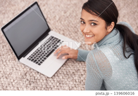 Portrait of girl on carpet with laptop, smile and relax with studying, research and browse on web in living room. Happy student woman on floor with computer, elearning and online education in home. 139606016
