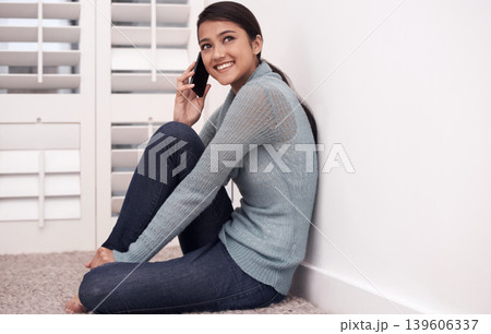 Happy woman on floor with phone call, relax and conversation with mobile connection in apartment. Girl sitting on carpet with smile, talking on cellphone and communication for networking in home. Happy woman on floor with phone call, relax and conversation with mobile connection in apartment. Girl sitting on carpet with smile, talking on cellphone and communication for networking in home. 139606337