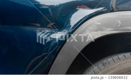 Damage of car. A long dent extends from the rear side door to the wheel arch. Damage of car. A long dent extends from the rear side door to the wheel arch. 139606632