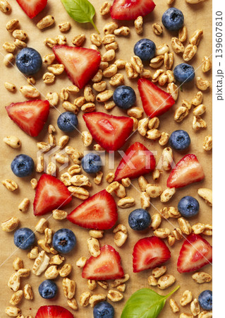 Granola with strawberries and blueberries flat lay food background Granola with strawberries and blueberries flat lay food background 139607810