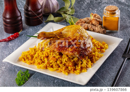 Roasted chicken leg with yellow rice 139607866