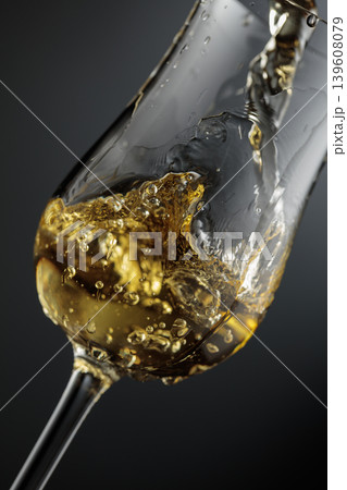 Whiskey is poured is poured into a glass. Whiskey is poured is poured into a glass. 139608079