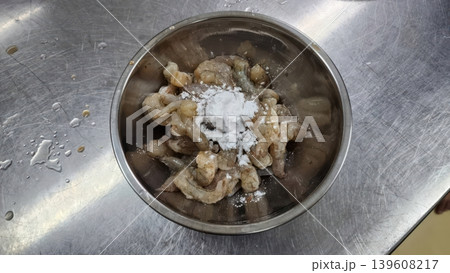 Fresh Raw Peeled Shrimp with Starch Powder in a Stainless Steel Bowl Fresh Raw Peeled Shrimp with Starch Powder in a Stainless Steel Bowl 139608217
